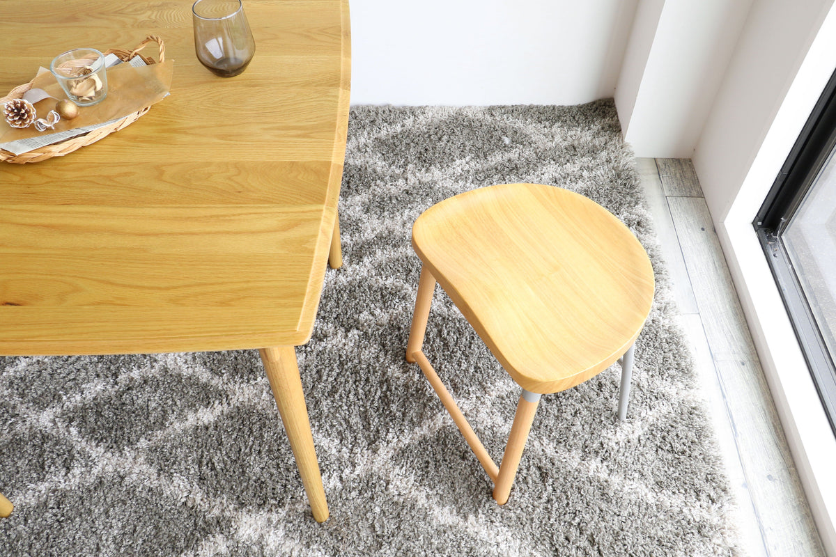 Tabouret bas rembourré gris