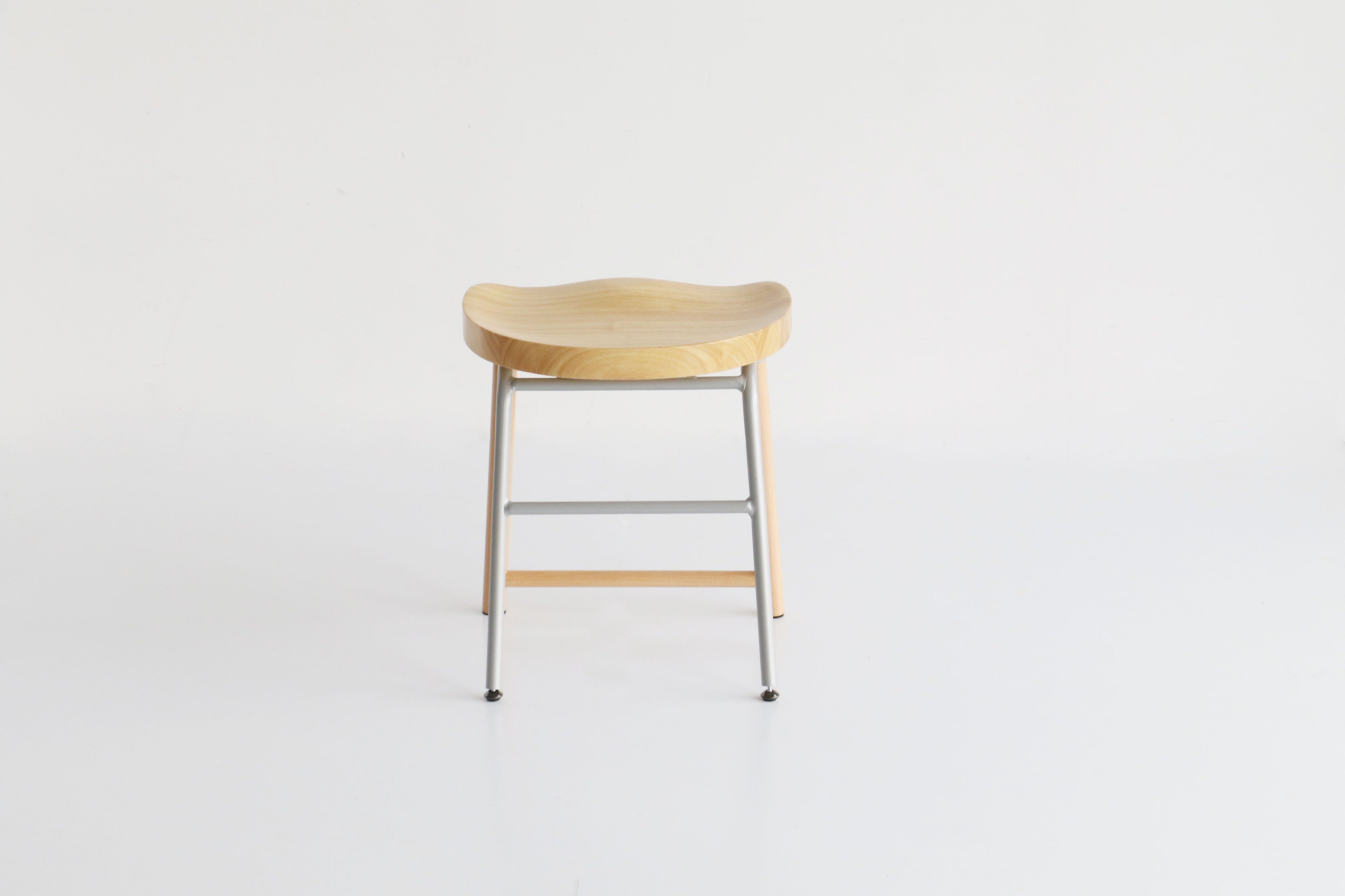 Tabouret bas rembourré gris