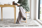Tabouret bas rembourré gris